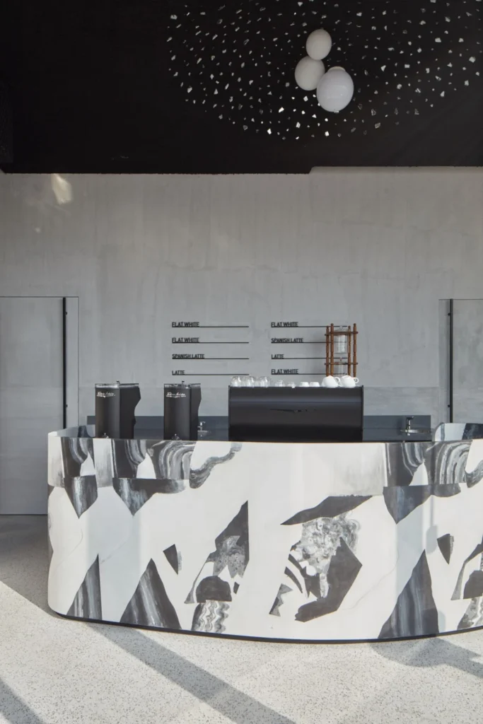 Coffee shop fit-out featuring a custom service counter, specialty coffee station, and modern hospitality interior by Exceptional PM.